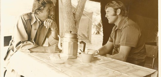 Jock getting to know his clients over coffee in the mess tent.
